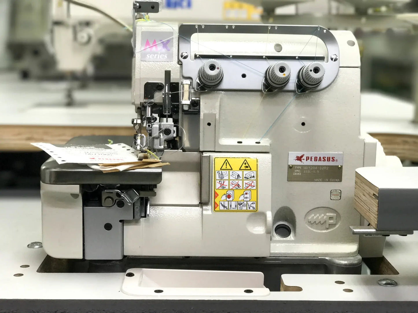 Pegasus MX5204-32R2/223L 1.5 Merrow High- Speed Turn Down Hemming Sewing Machine With Table and Servo Motor