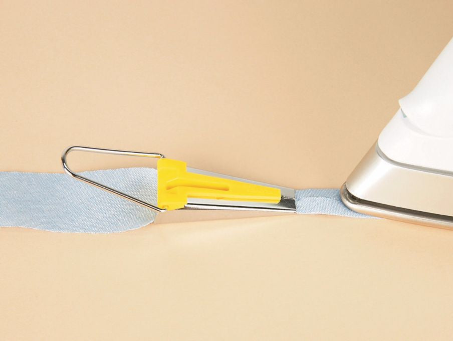 1/2" BIAS TAPE MAKER,Cut 1" bias strip Slip the bias strip in wide end and p