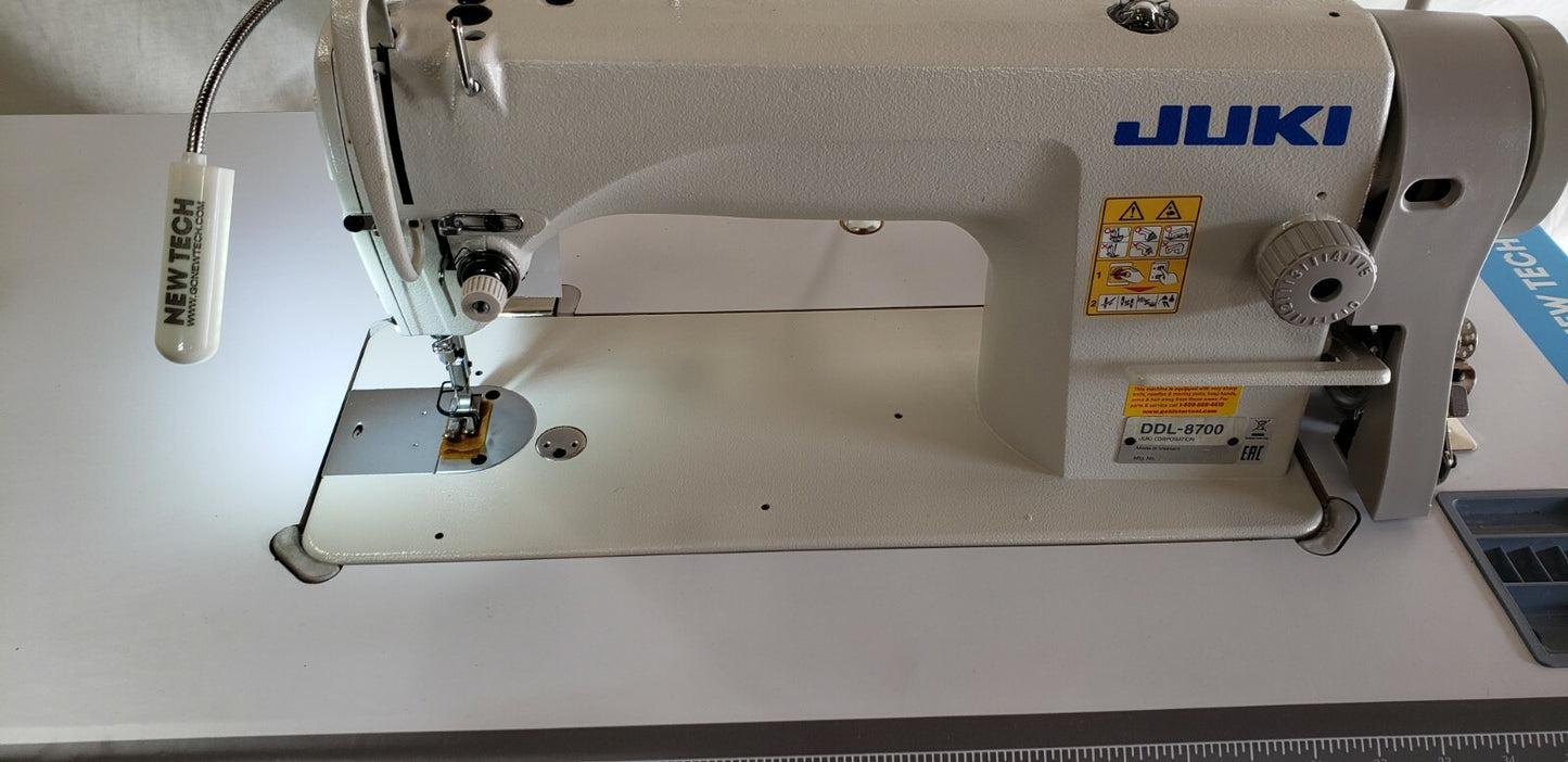 Juki DDL-8700 SEWING MACHINE WITH T-LEGS STAND ,CASTERS,SERVO MOTOR LED LAMP