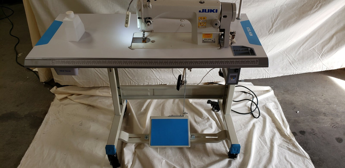 Juki DDL-8700 SEWING MACHINE WITH T-LEGS STAND ,CASTERS,SERVO MOTOR LED LAMP