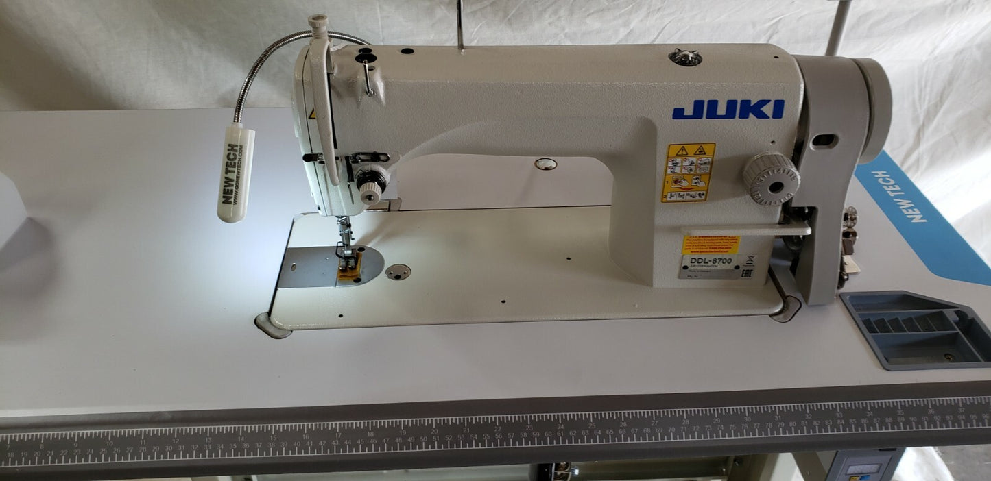 Juki DDL-8700 SEWING MACHINE WITH T-LEGS STAND ,CASTERS,SERVO MOTOR LED LAMP